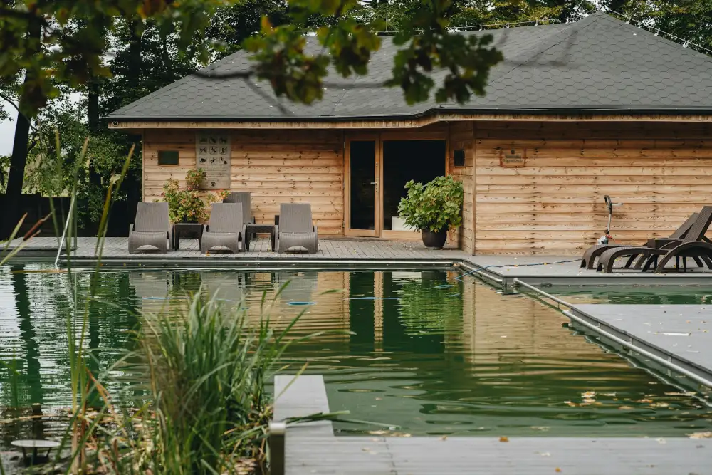 rustic wood pool house by a pool